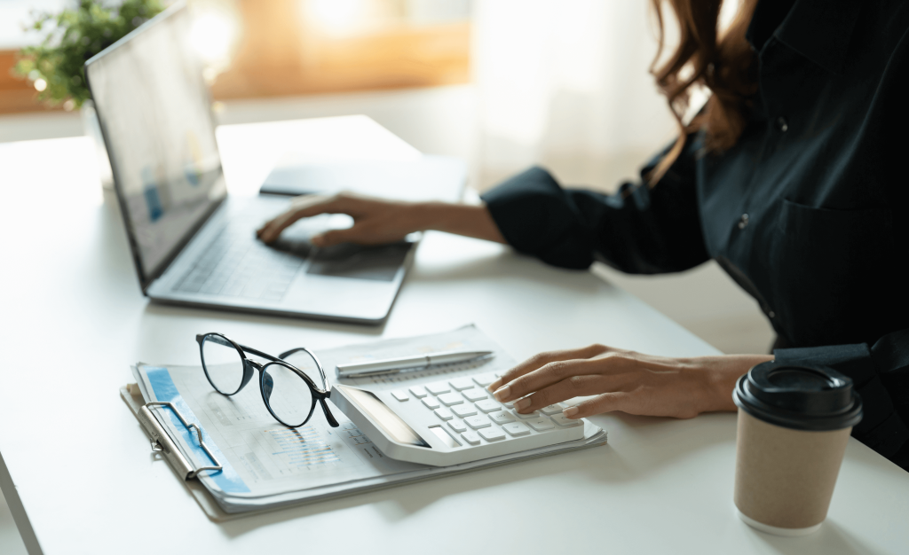 Woman working on laptop at home – expert support with your first-time buyer mortgage in Warwickshire from start to finish