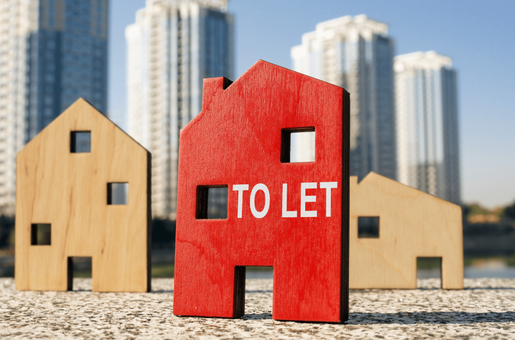 wooden house model with To Let sign